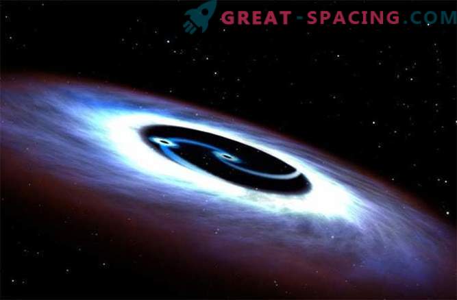I buchi neri ruotano attorno a un quasar in una battaglia mortale